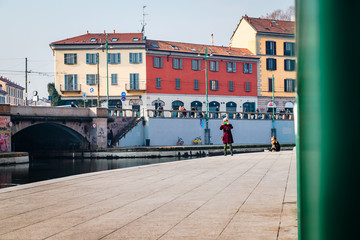 Fototapeta na wymiar Milan, Navigli (Darsena) people on a sunny winter day