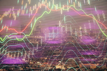 Financial graph on night city scape with tall buildings background double exposure. Analysis concept.