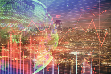 Financial graph on night city scape with tall buildings background double exposure. Analysis concept.