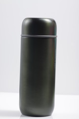 metallic black insulated tumbler on a white isolated background