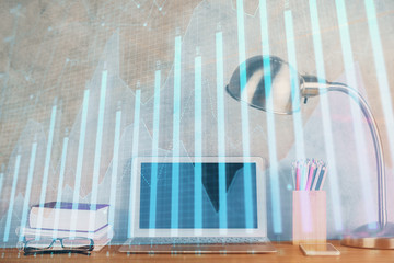 Multi exposure of graph and financial info and work space with computer background. Concept of international online trading.