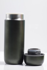 metallic black insulated tumbler on a white isolated background