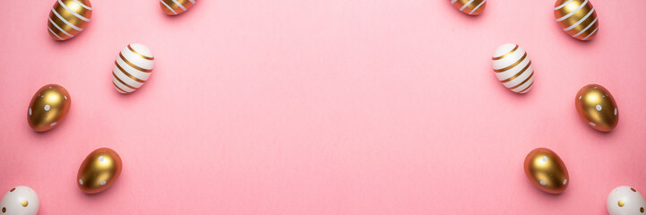 Happy Easter eggs pink background. Golden shine decorated eggs in basket, for greeting card, promotion, poster.