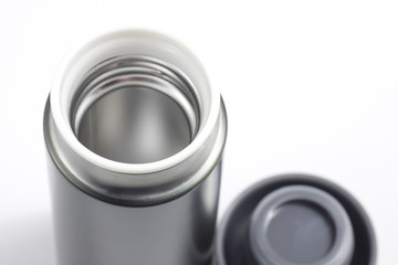 metallic black insulated tumbler on a white isolated background