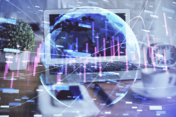 Stock market graph and table with computer background. Double exposure. Concept of financial analysis.