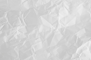 white and gray wide crumpled paper texture background. crush paper so that it becomes creased and wrinkled.