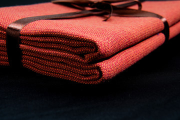 brown ribbon towel on a black background