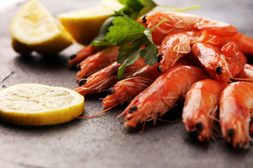 Raw fresh Prawns Langostino Austral. shrimp seafood with lemon and spices on background
