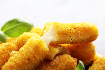 Breaded mozzarella cheese sticks with tomato ketchup