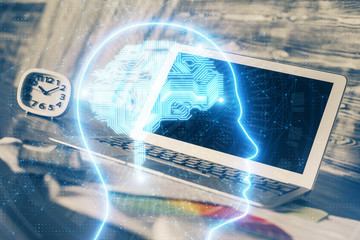 Multi exposure of work space with computer and human brain hologram. Brainstorm concept.