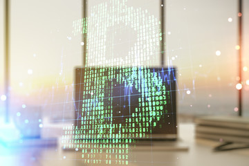 Double exposure of creative Bitcoin symbol hologram with computer on background. Mining and blockchain concept