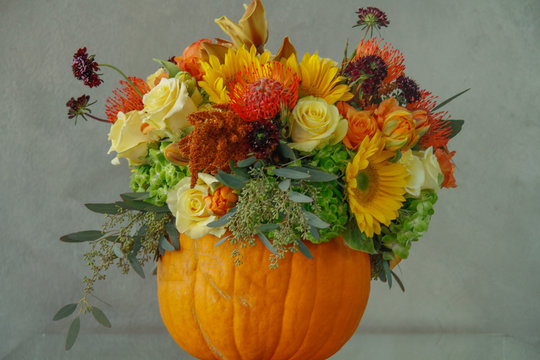 Flowers in a Pumpkin Seasonal Autumn Display 