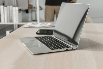 Computer laptop on desk in office