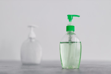 hygiene against viruses and bacteria, hand sanitizer and liquid soap bottle on marble bathroom