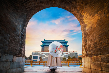 A Chinese girl in traditional winter dress at Qianmen or Zhengyangmen Gate in Beijing, China