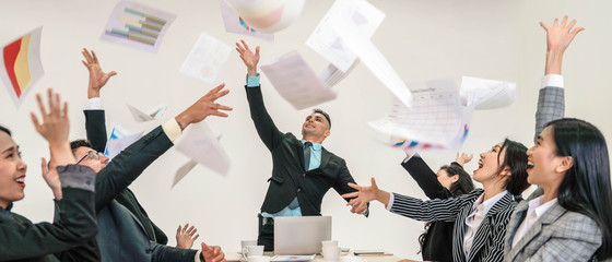 business background of business people show exiting and celebrate business success by together throwing paper to air, selective focused