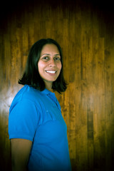 Fototapeta premium A Side portrait shot of swimming champion Nisha Millet with a big smile