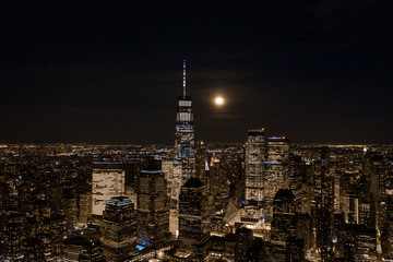 Aerial view of NewYork City and downtown skyline from Hudson River at night