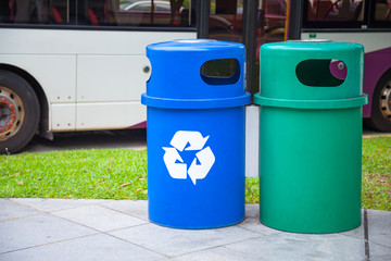 Obraz premium Blue Recycling Bin collects recyclables or recycled material like glass bottles, jars, cartons, plastic bottles and cans. Green Bin is for household organic waste. Waste Separating or Sorting concept