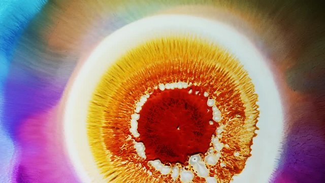 Bright Yellow solar flare reaction with liquid ink / paint drop stain on black background / oil bleed bloom / Big Bang explosion of supernova sun star / NASA Hubble nebula universe