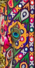 Fototapeta premium peacock feathers on embroidery arts,handmade embroidery arts close up views, mirror and arts work close up views,Presenting different type of stitches. Embroidery process. Needlework
