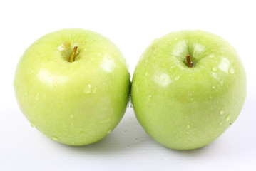Green apples on a white background