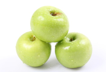 Green apples on a white background