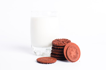 glass of milk and cookies isolated on white