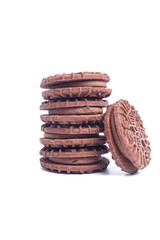 A picture of homemade chocolate cream biscuits on isolated white background.