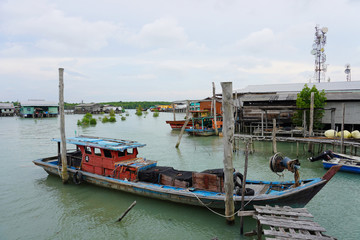 Fototapeta na wymiar Pulau Ketam is an island at the mouth of the Klang River, near Port Klang. It host Chinese fishing villages comprising houses on stilts and the boat is the main transport here. 