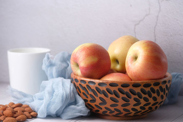 fresh red apple with wooden bowl, close up 