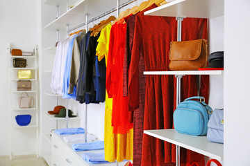 Stylish clothes and accessories in modern store
