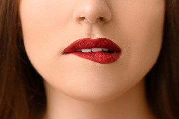Fototapeta premium Beautiful young woman with bright lips, closeup