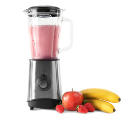 Blender with ingredients for healthy smoothie on white background