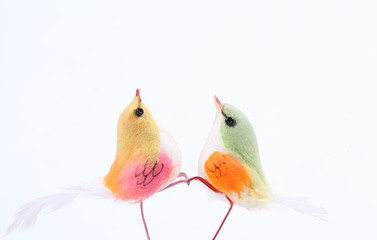 Artificial feather birds for interior decoration isolated on white