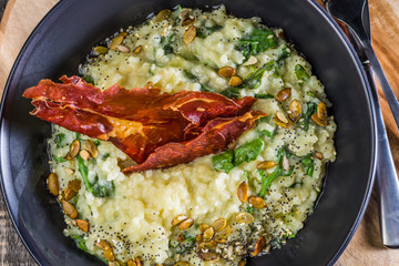 Blue Cheese Risotto with Flame Grilled Capsicum, Pumpkin Seeds and Rocket Leaves.