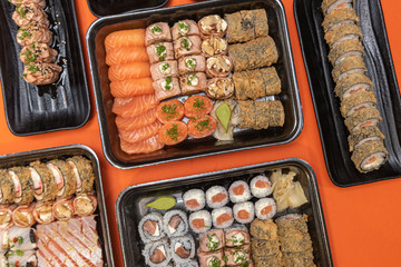 Delicious and beautiful sushi on the orange table