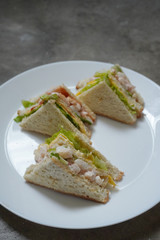 Delicious crayfish/king prawn with cheese and omelette sandwich on malted bread and mayonnaise on fresh lettuce.