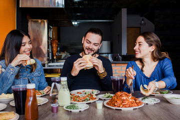 eating tacos, mexican people eating taco al pastor in mexico city