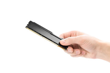 Hand holds RAM with cooling for the computer. Close up. Isolated on a white background