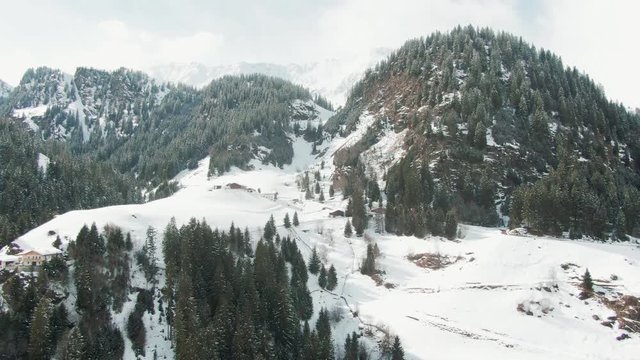 Aerial drone shot of some majestic Snow Capped Mountains of the Alps in Austria