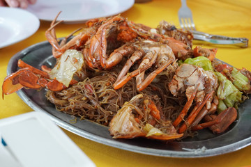 Chinese fried rice thin noodles with black soy sauce and fresh crab.     