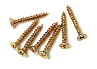 Golden screws isolated on white background
