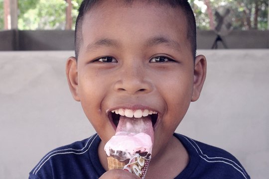 Portrait Of Boy Eating Ice Cream