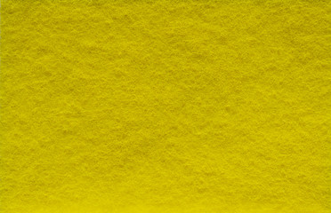 Obraz premium Yellow background with fleecy texture like Scotch Brite.