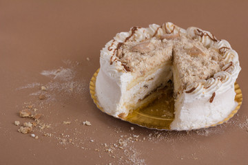 White cream cake with cookies pieces