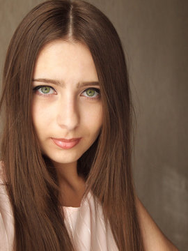 Close-up Portrait Of Brunette Woman With Green Eyes