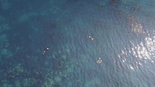 Vertical Aerial of Korean Divers Tilt Up To Crater Pulling Away