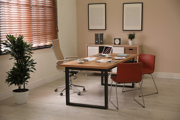 Director's office with large wooden table. Interior design