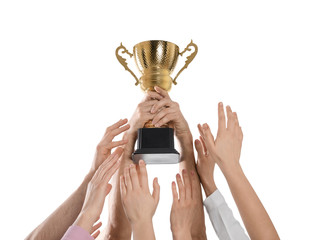 People with gold trophy cup on white background, closeup